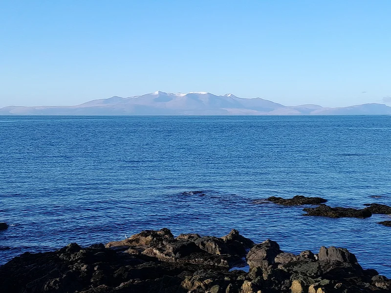 The Isle of Arran with snow-topped peaks as seen from Ardrossan